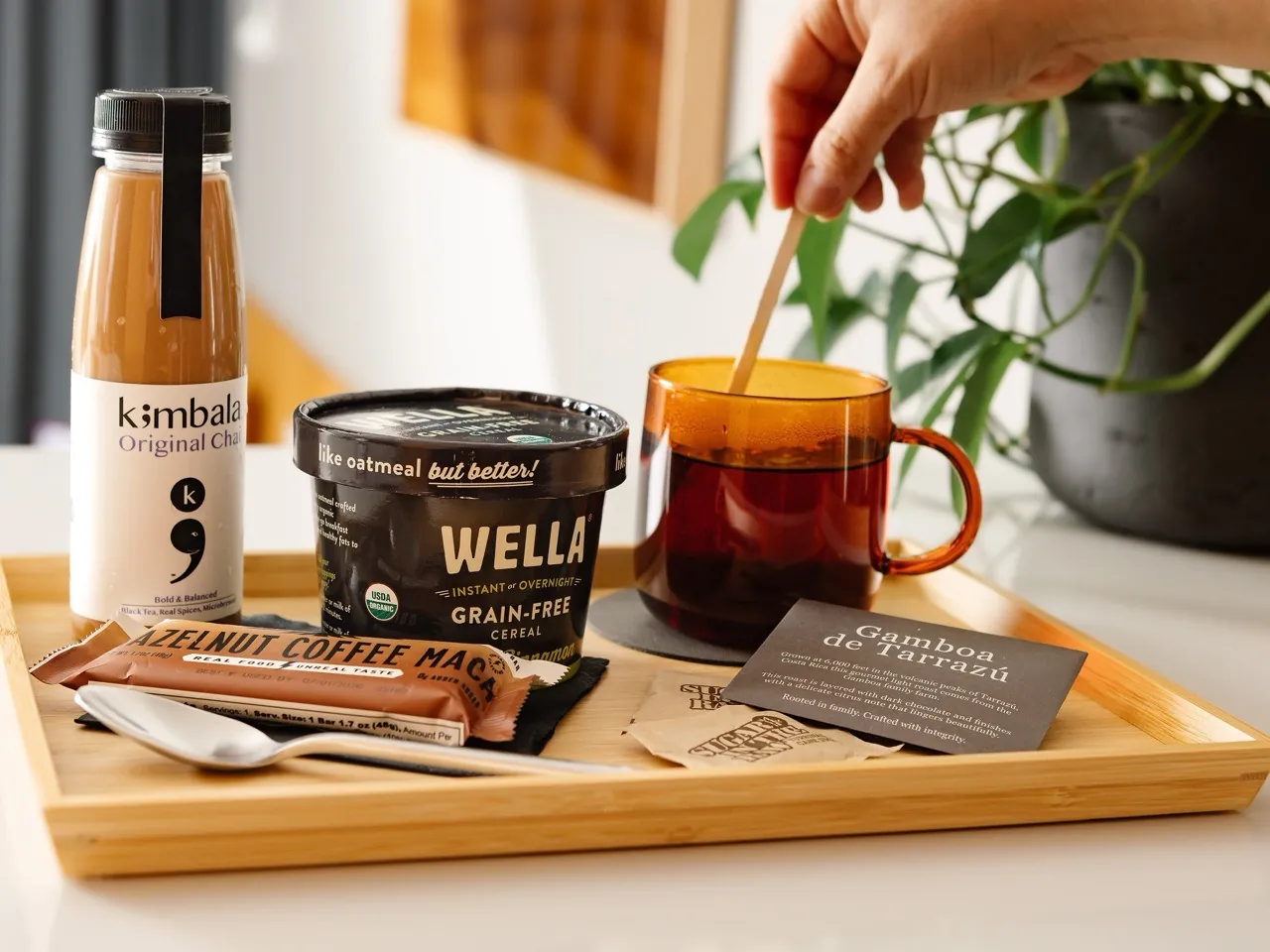 Frame Finds shelf with curated coffee, snacks, and in-room essentials